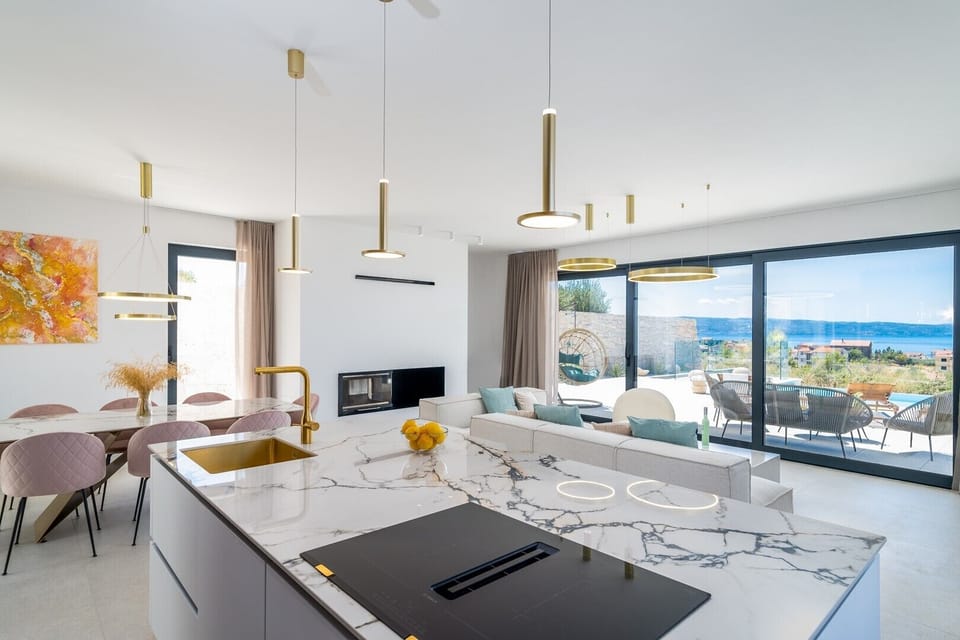 A kitchen is equipped with a modern kitchen island