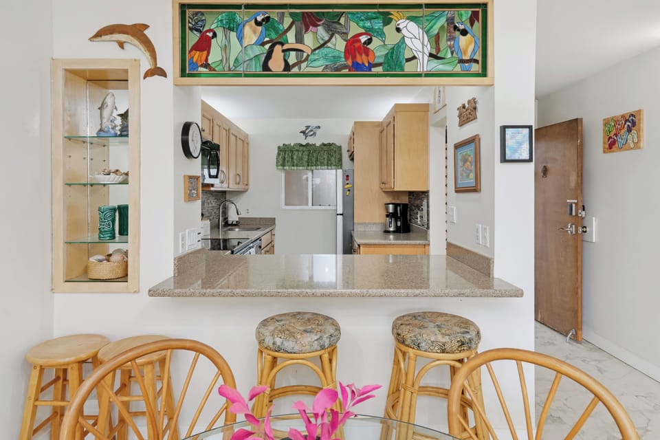 Four person dining table with bar seating.