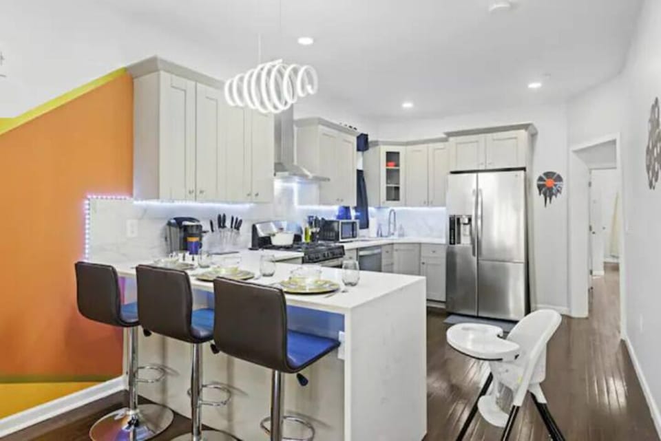 
Welcome to our charming kitchen nook, a delightful and intimate dining area nestled within the heart of the kitchen. With a cozy table and comfortable high chairs, it's the perfect spot for enjoying quick meals, sipping coffee, or engaging in casual conversations. Abundant natural light streams through nearby windows, adding warmth and brightness to this inviting space. Whethe...