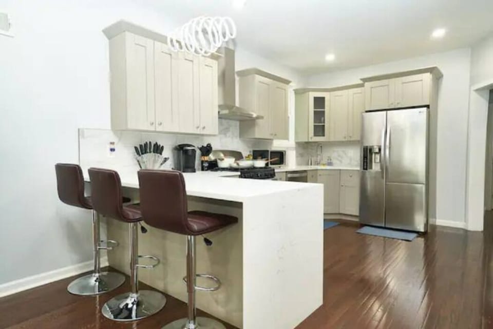 Discover a charming kitchen nook with a cozy table and comfortable high chairs. Enjoy quick meals and warm conversations in this intimate and inviting space.