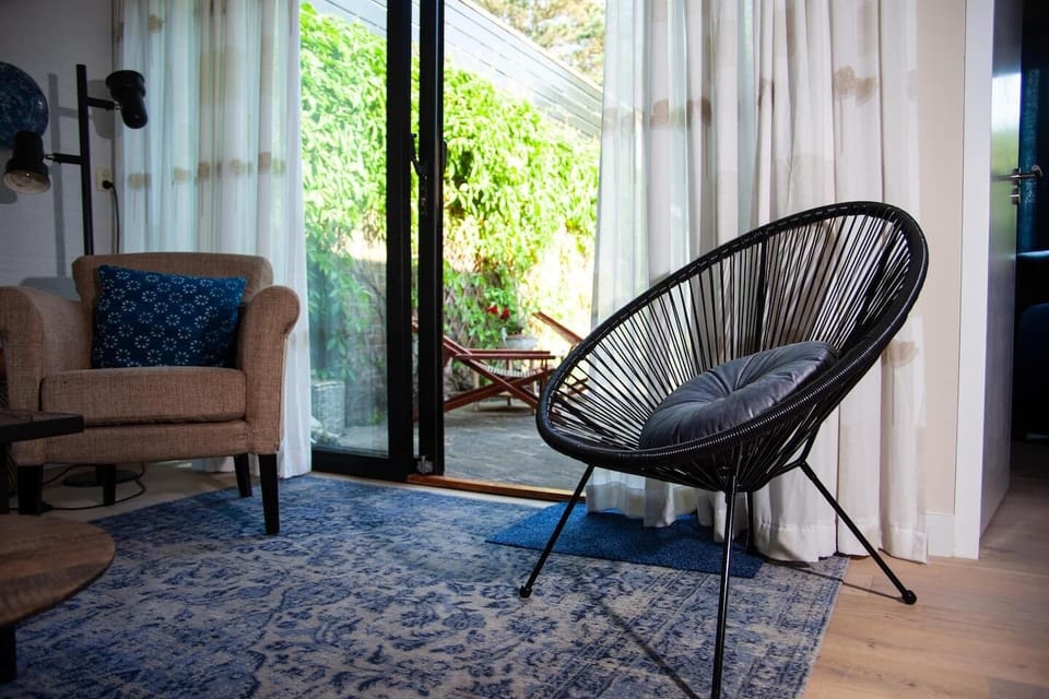 The sunny garden provides Weber BBQ, sun loungers, wooden garden set & fire pit