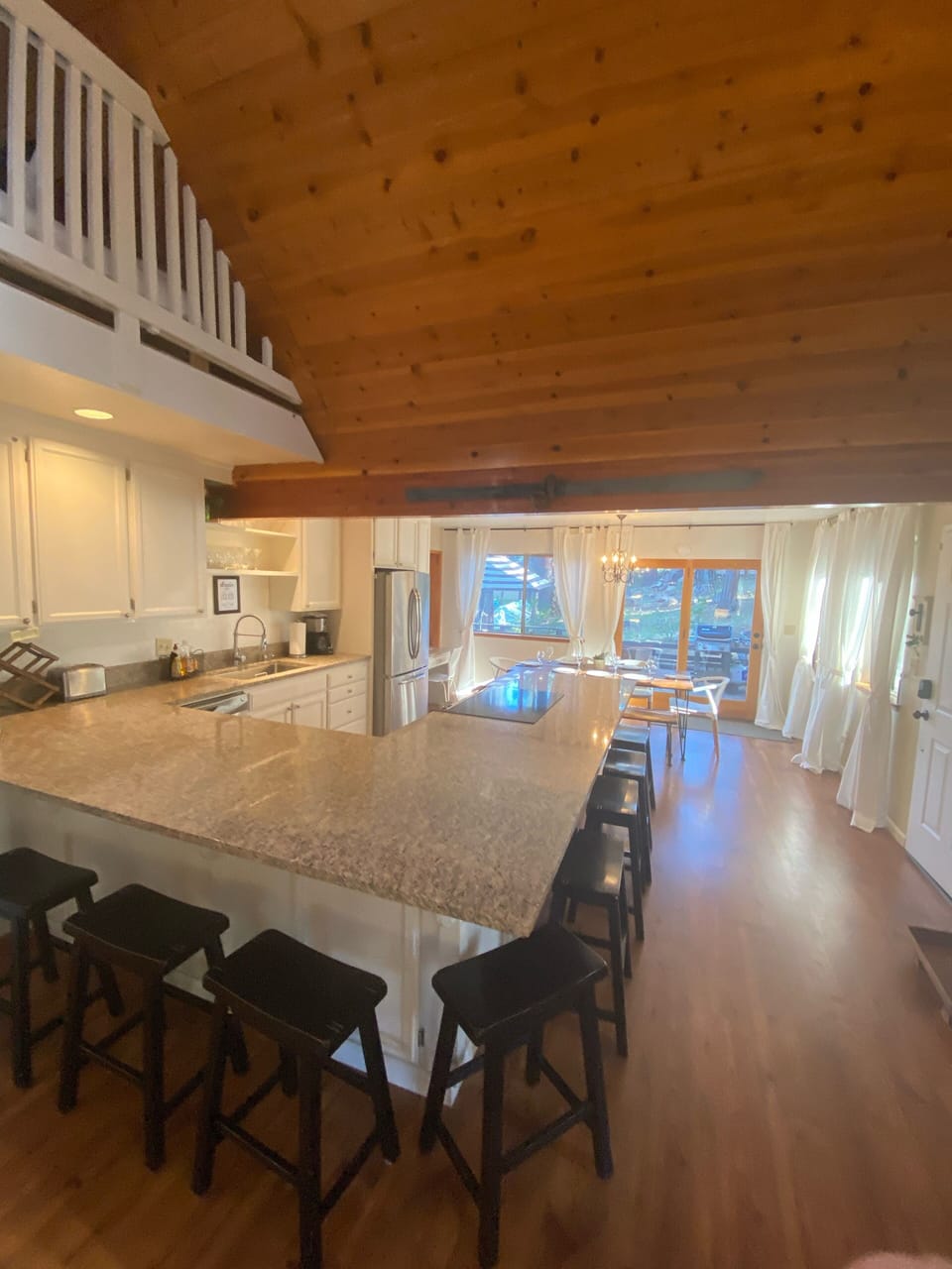 Host your favorite people at the open kitchen bar with seating fir 8
