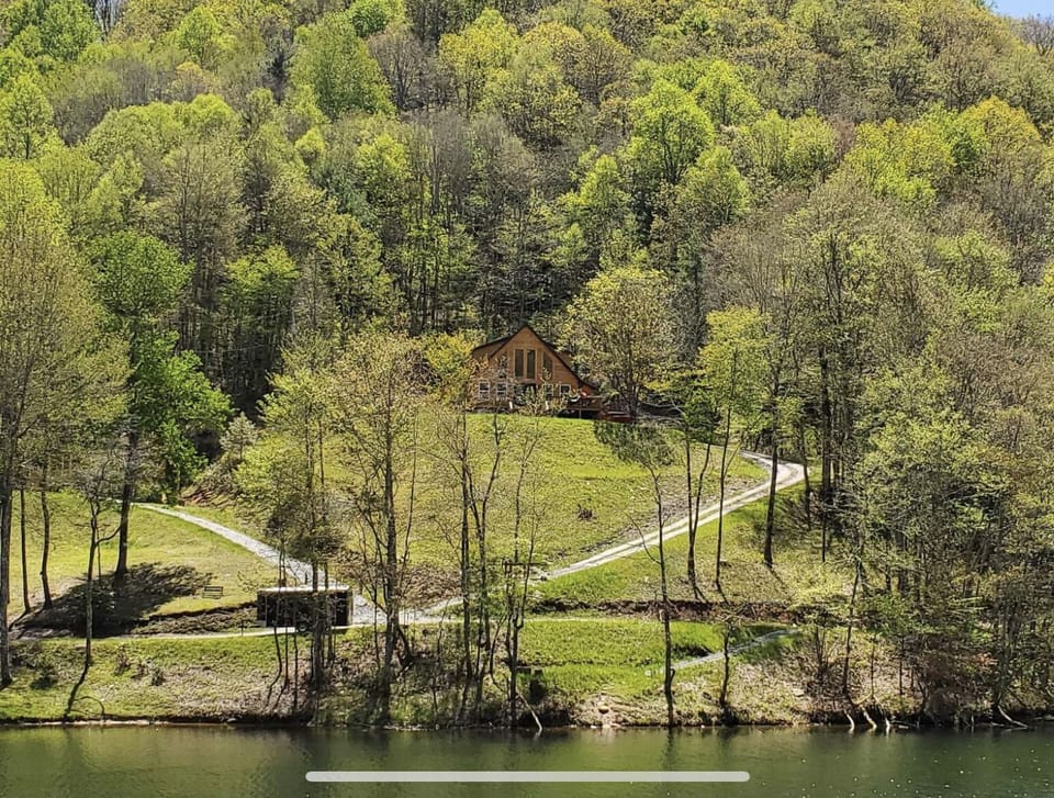 This pic of the cabin was taken from a kayak in the lake, May 2023