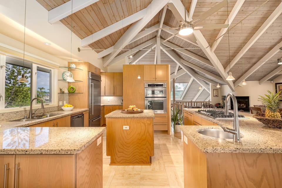 Kitchen features stainless steel appliances, double sink, and a single sink.