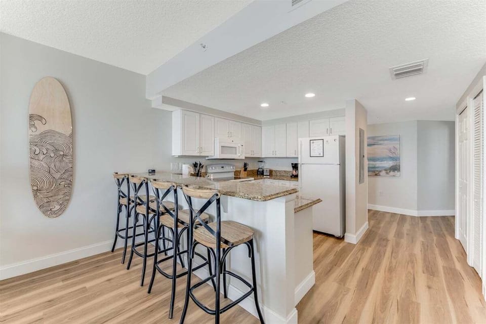 Extra seating at the bar of this beautiful kitchen