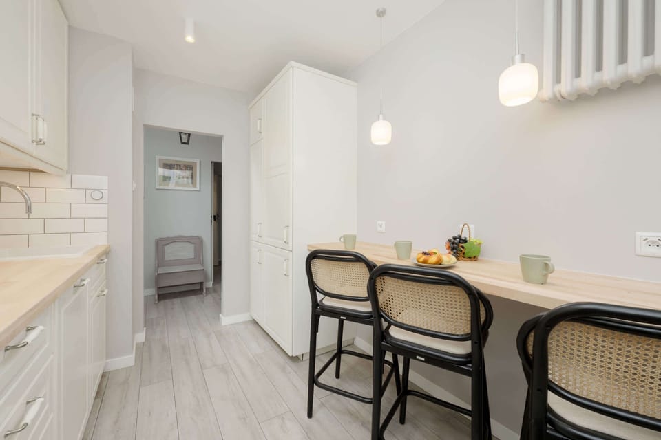 The kitchen's stylish decor complements the apartment's overall design.