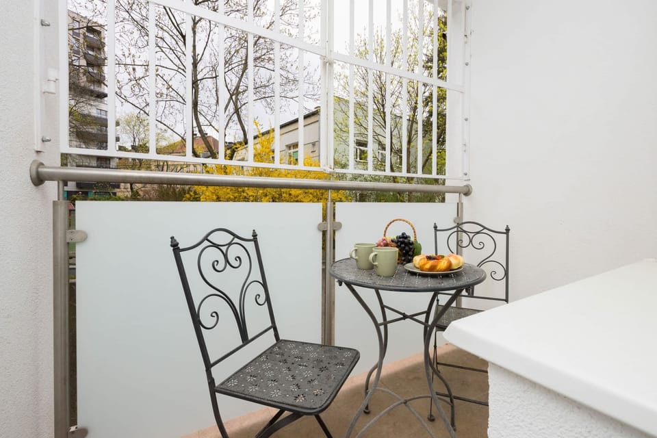 The balcony provides a tranquil spot for enjoying a book. 