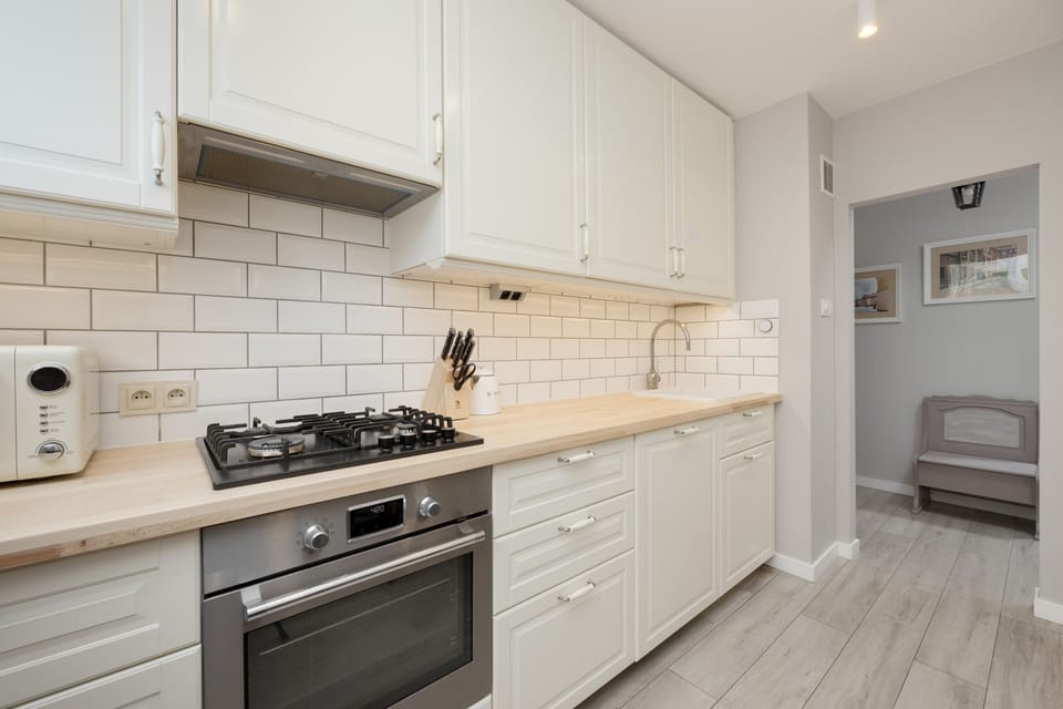 The kitchen's practical layout is perfect for preparing home-cooked meals. 