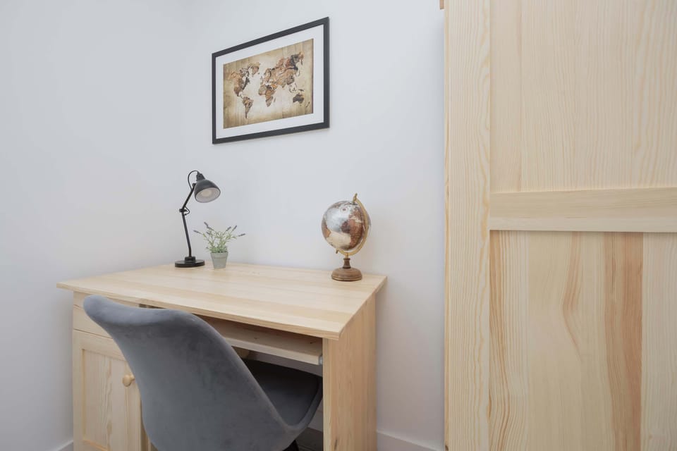 A desk with a chair perfect for remote work.