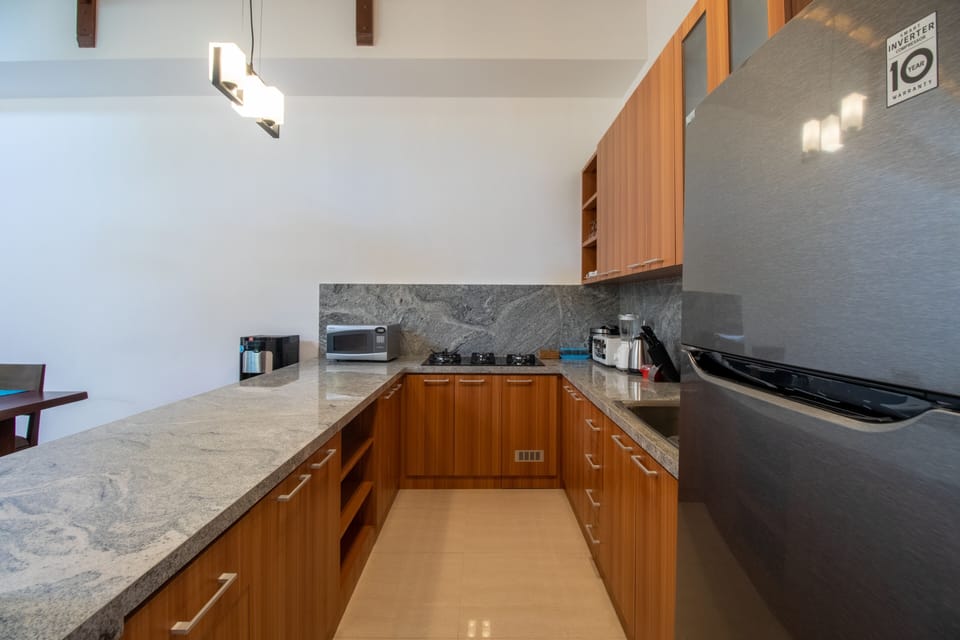 Exclusive Villa | Private kitchen | Fridge, stovetop, electric kettle, toaster