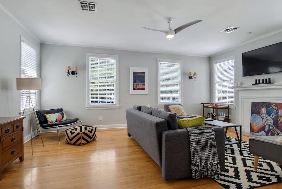 Living room features a sectional sofa & large screen smart tv. (Note, sofa has changed since photo - it is larger and seat more guests comfortable).