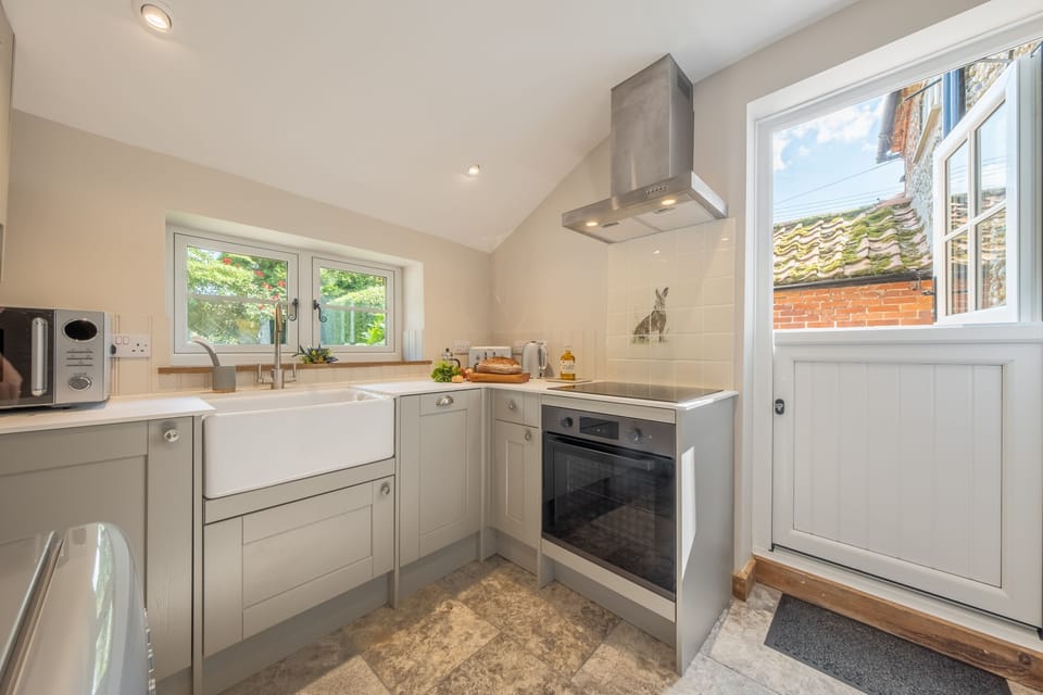 Ground floor: Kitchen with door opening to the garden