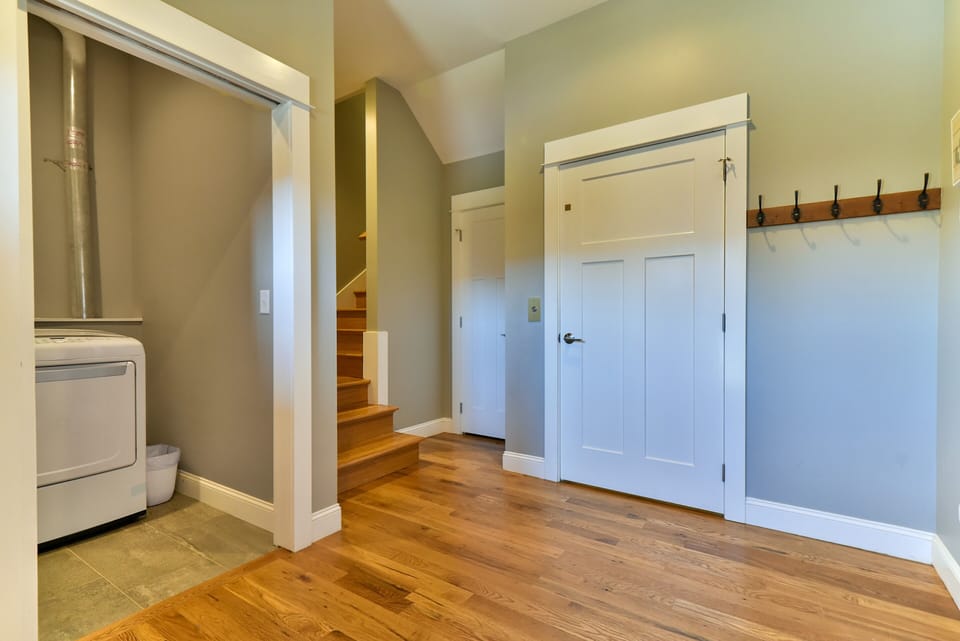 Foyer with access to laundry room, coat closet, elevator and garage. 