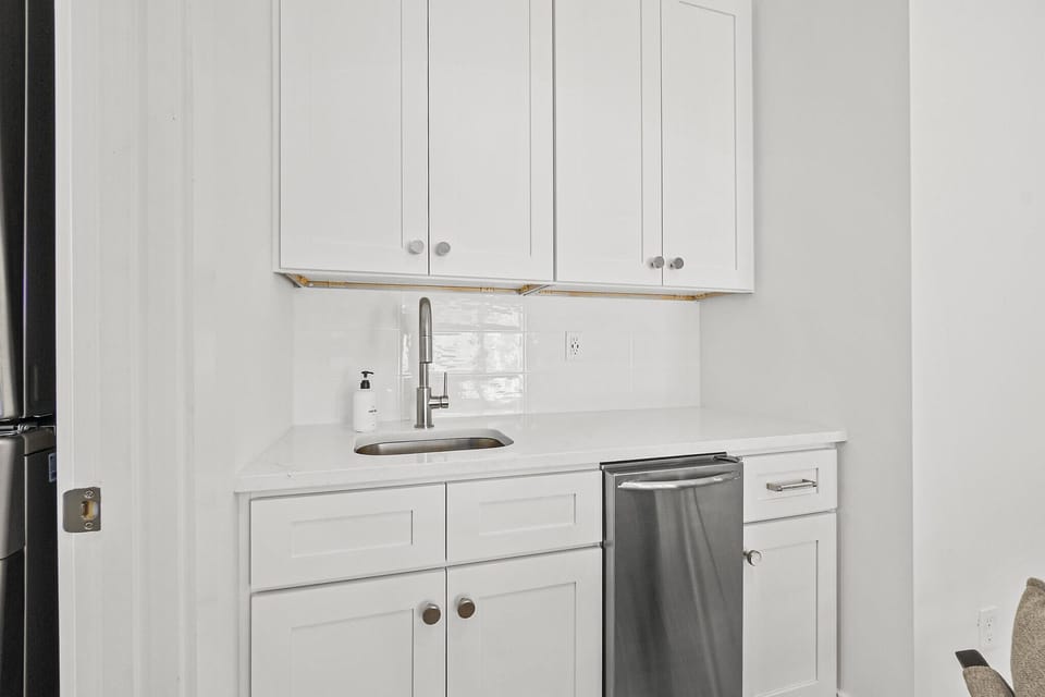 The wet bar with a fridge to keep the beer and champagne cool