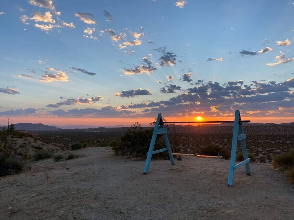 Swing into the sunset—where golden skies and desert breezes bring a sense of peace and nostalgia.