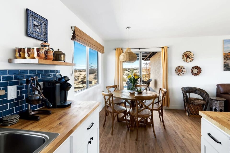 A charming blend of rustic elegance and modern comfort—this kitchen and dining area is perfect for gathering and creating memories!