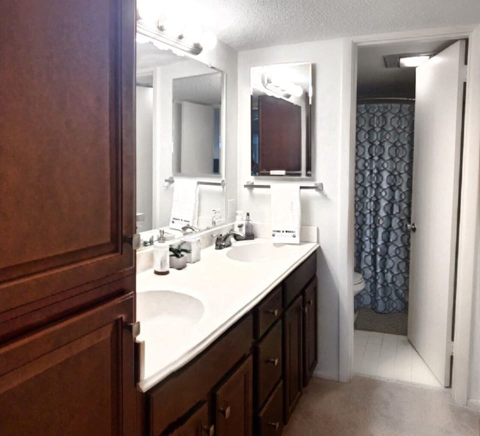 Master Bedroom en-suite with double sinks and private shower/toilet