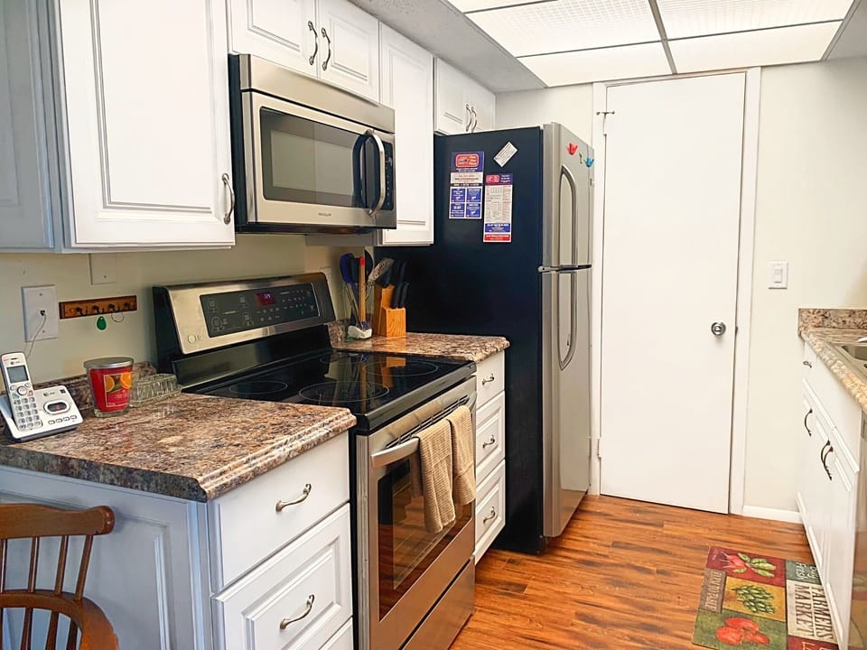Full clean kitchen with expansive pantry