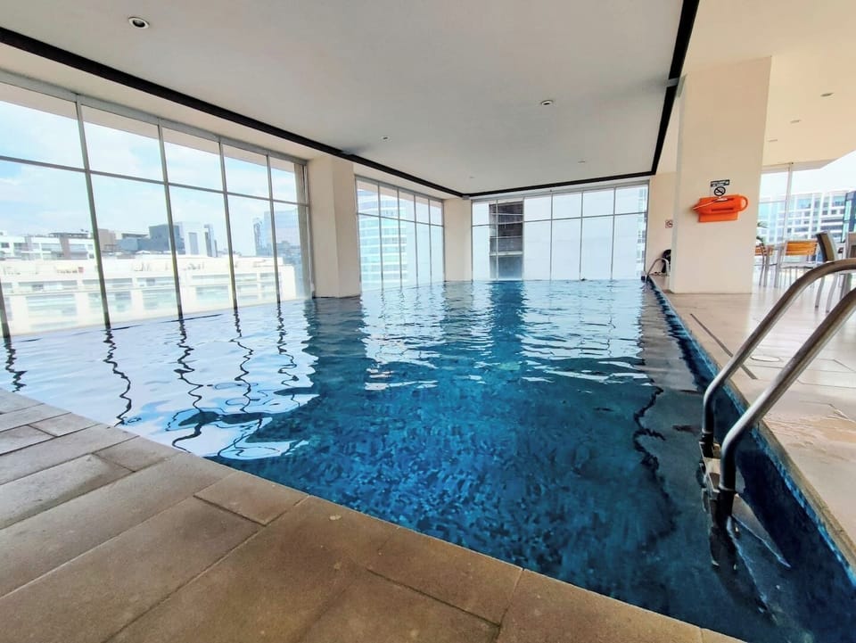 On the 16th floor, you'll find a stunning pool offering breathtaking views. Unwind in its serene waters and enjoy the poolside ambiance. Adjacent is the bar/cafeteria, where you can indulge in refreshing drinks and delicious snacks.
