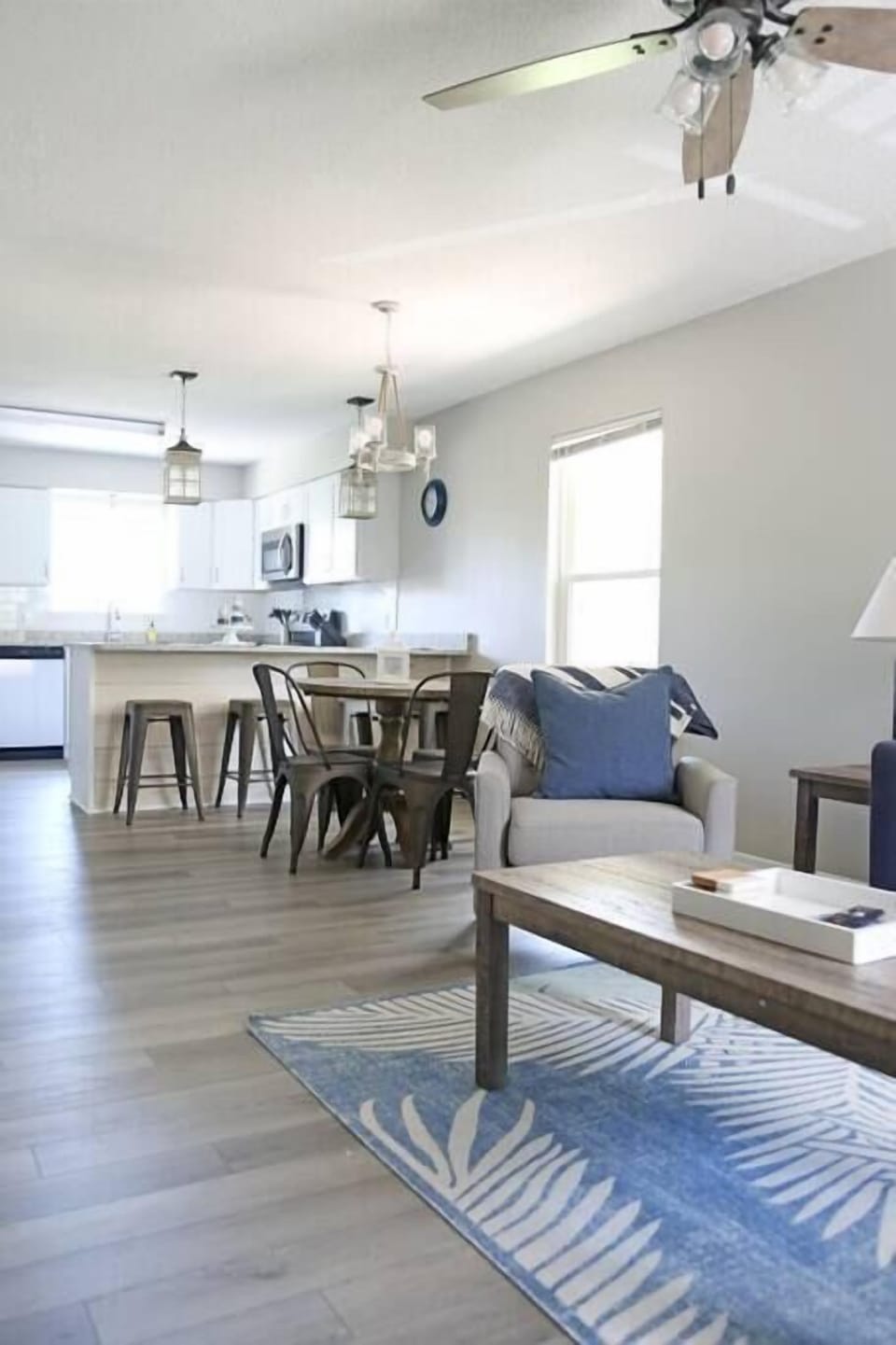 Spacious, open-concept design seamlessly connecting the living room and kitchen for a bright and airy feel.