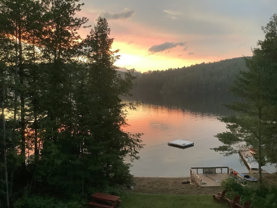 View of lake with floating swim dock and boat dock
