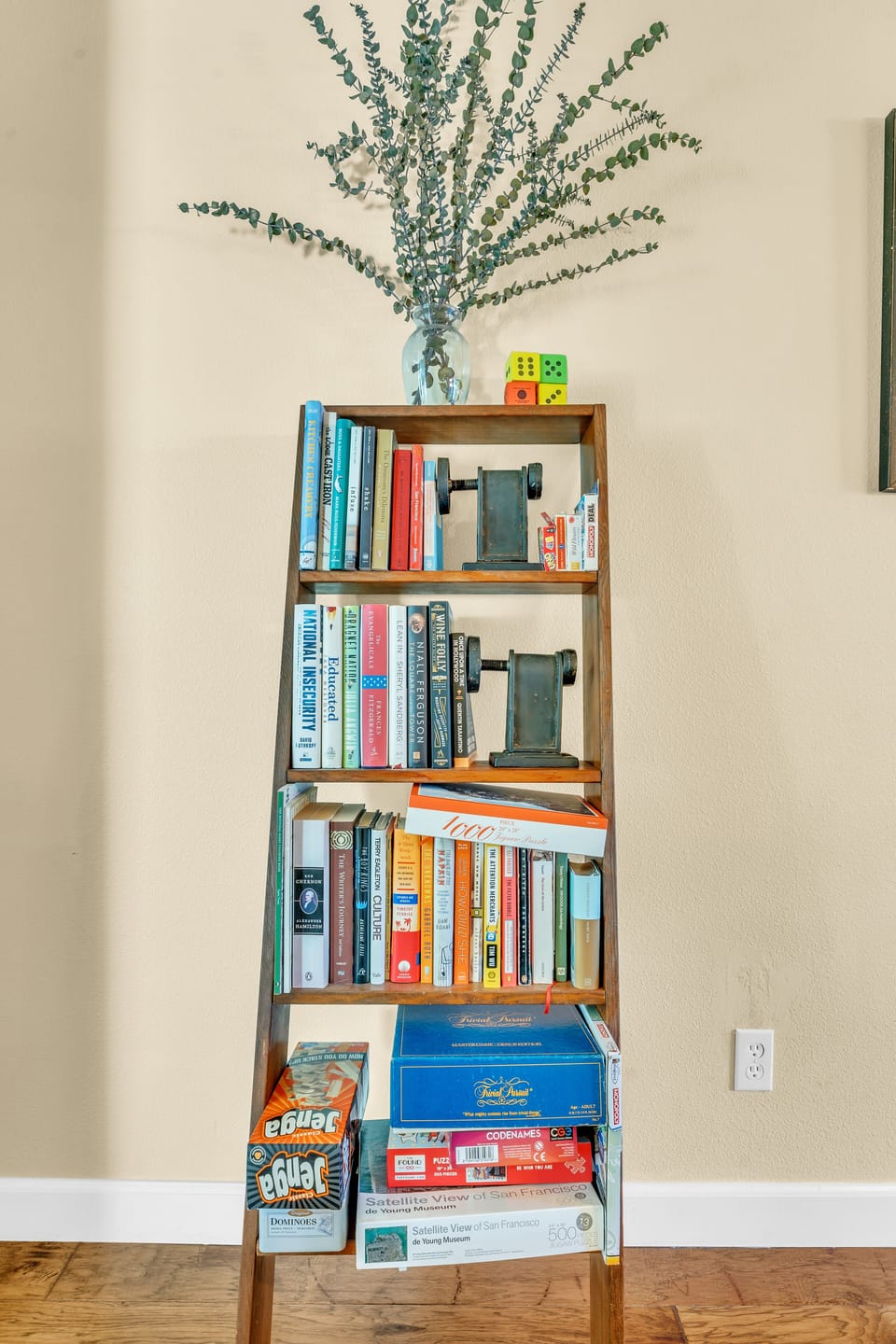 Books and games—Monopoly Deal, Trivia Pursuit, Jenga, Codenames, puzzles, cards