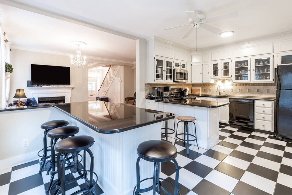 Gorgeous open black and white Gourmet kitchen.