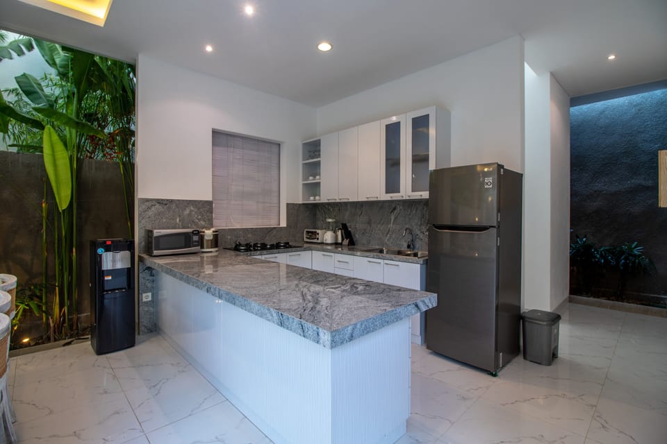 Villa | Private kitchen | Fridge, paper towels
