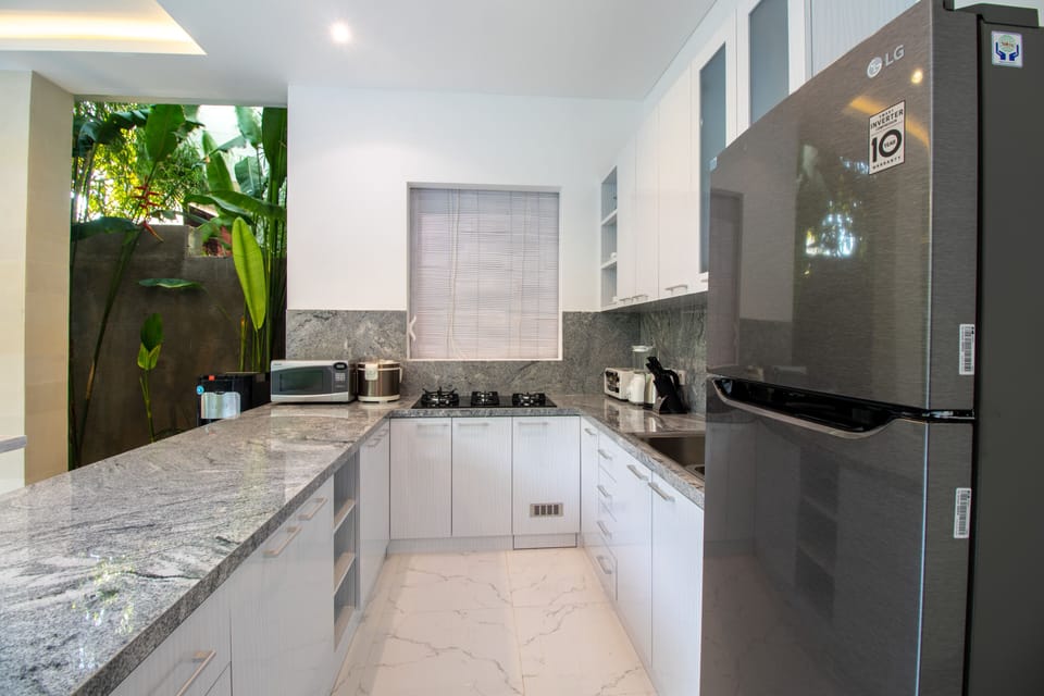 Villa | Private kitchen | Fridge, paper towels