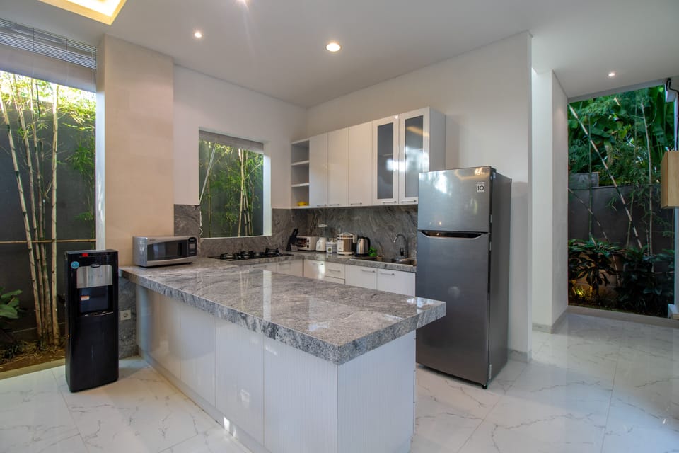 Villa | Private kitchen | Electric kettle, dining tables