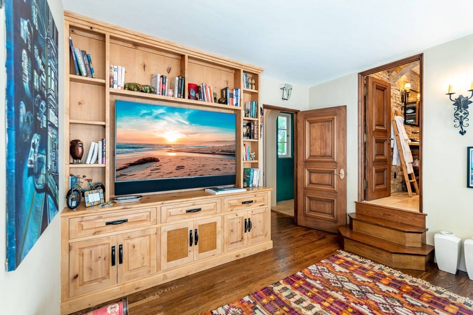 Our Den has a 65" SmartTV and brand new Queen size sofa bed.