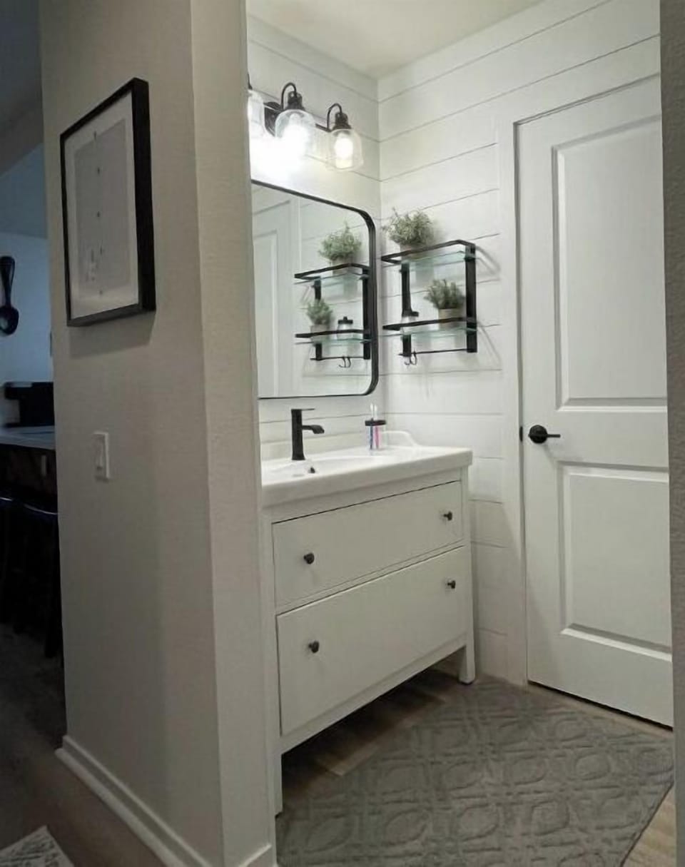 Clean vanity area with lots of drawer space. 