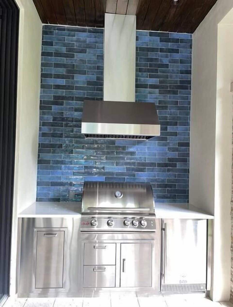Outdoor Kitchen located inside covered patio. 