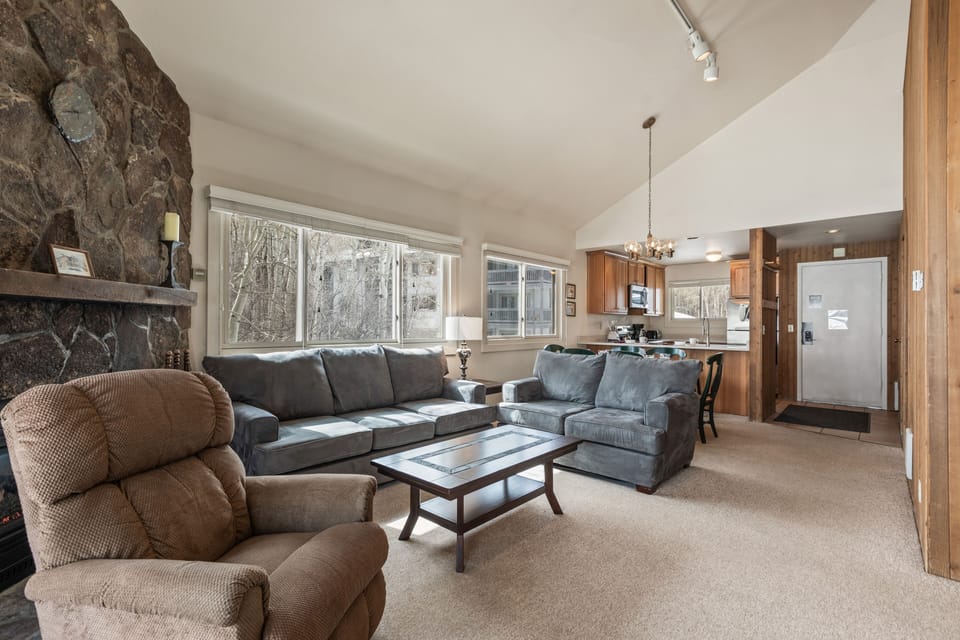 Premier Snow Flower Condominium 130's open concept living room and dining room.