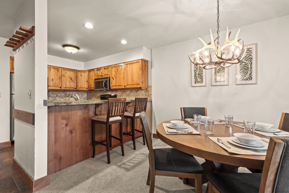 This ski-in/ski-out vacation rental features a fully equipped kitchen and elegant dining space.