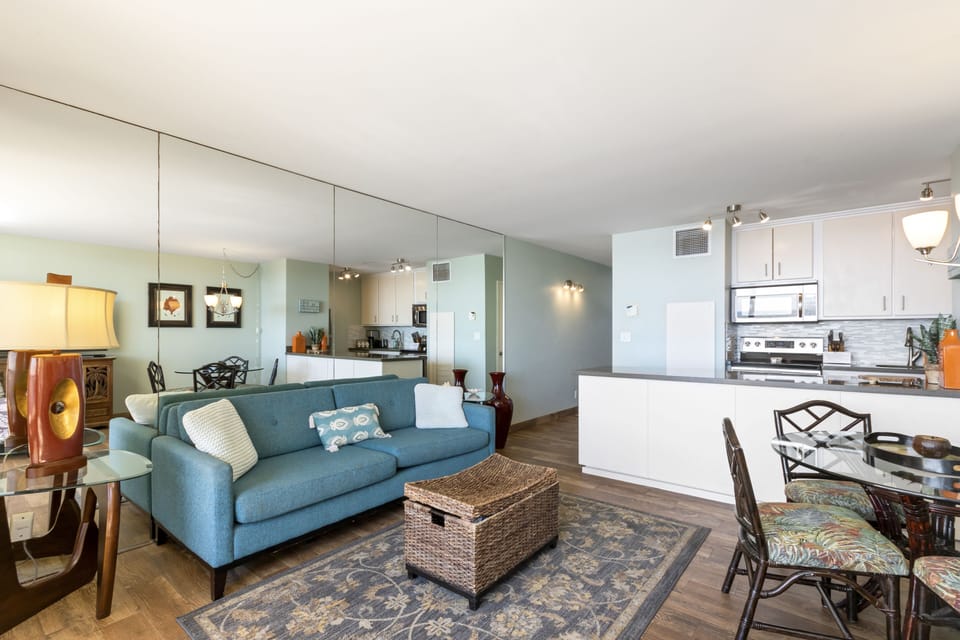 Settle into your open-concept retreat where the living room flows effortlessly into a fully equipped kitchen and dining space, perfect for relaxing evenings or hosting gatherings.