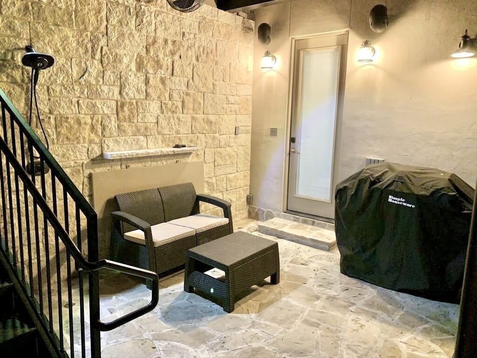 Upper rear patio #1 has a gas BBQ grill, fireplace, and an outdoor shower.