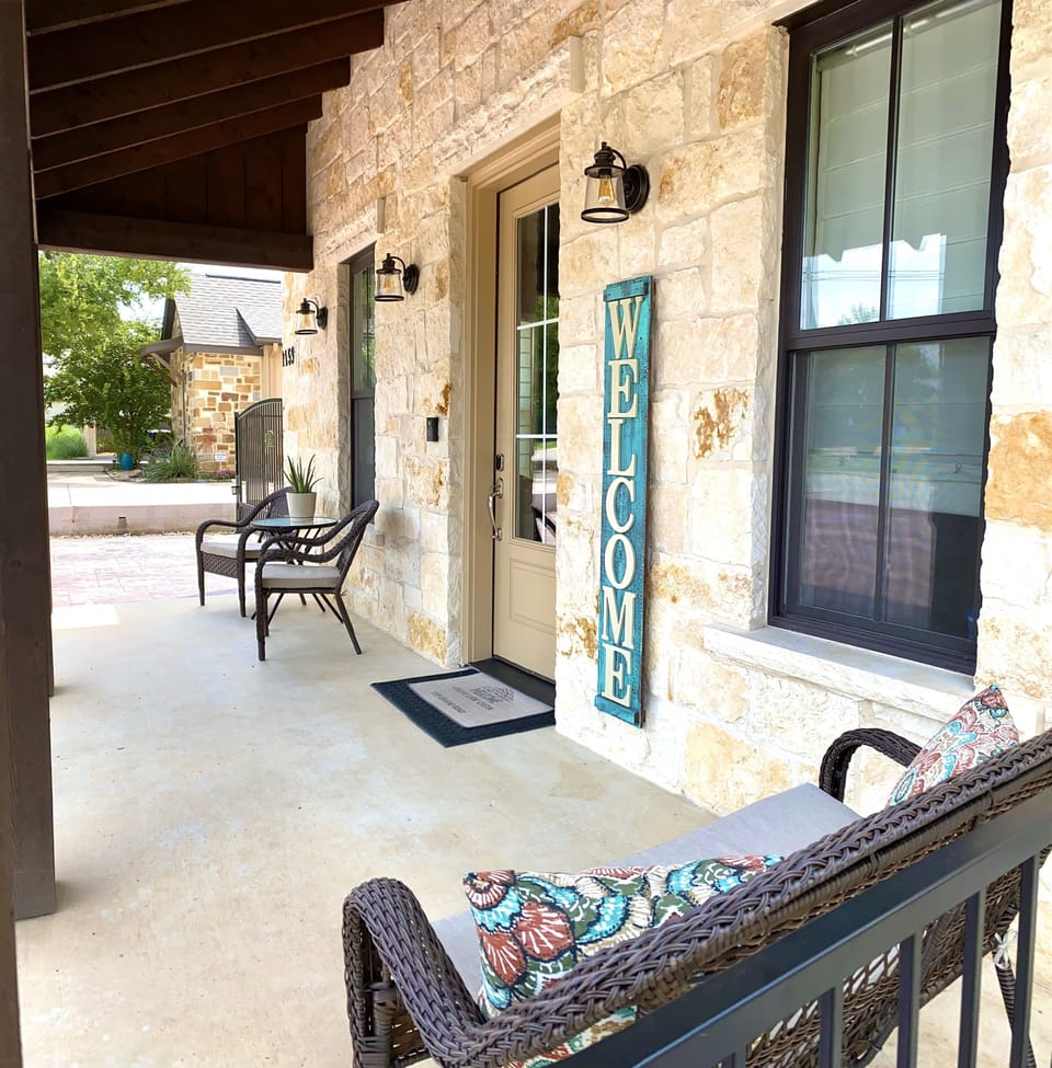 Front porch with outdoor ceiling fan.