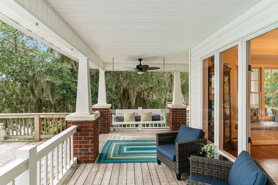 Back Porch facing the River and Pool
