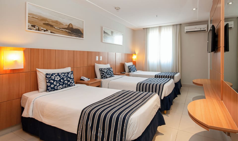 Deluxe Triple Room, 3 Twin Beds | Minibar, in-room safe, desk, soundproofing