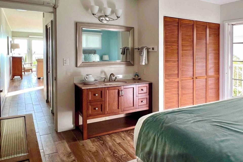 Bedroom has an extra vanity for getting ready to go out or bedtime routine. 