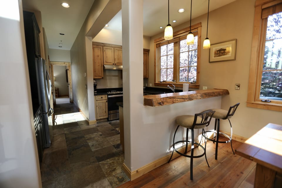 Hallway to master bedroom. As well as garage, laundry room and half bath.
