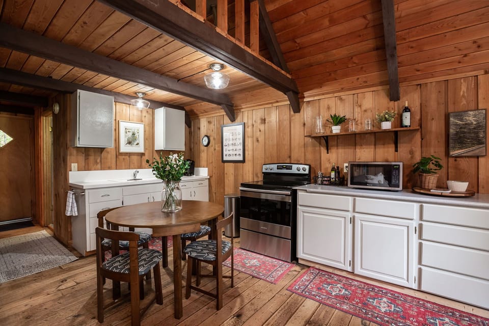 Fully equipped kitchen. Cupboards filled with the necessities to cook meals.