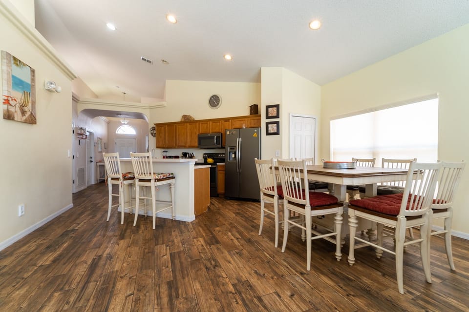 view of dining table and breakfast bar from living room
