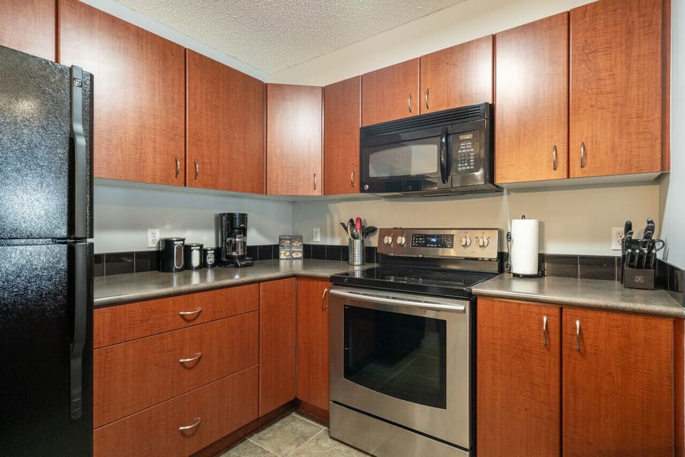 Full kitchen with a drip coffee machine, ground coffee, tea, sugar and basic condiments (ketchup, mustard and relish.)