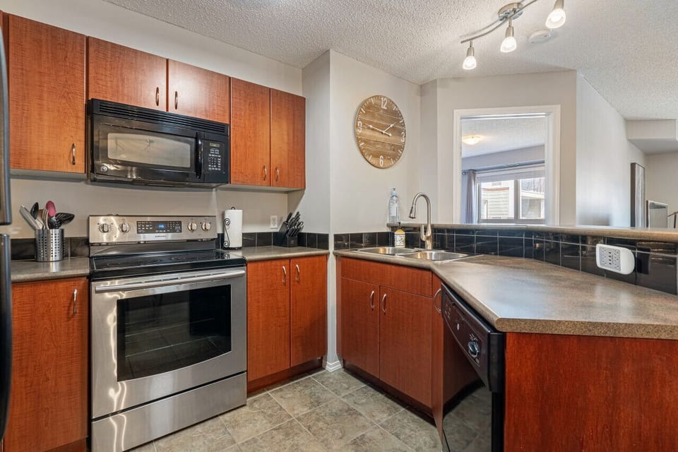 Full kitchen with a drip coffee machine, ground coffee, tea, sugar and basic condiments (ketchup, mustard and relish.)
