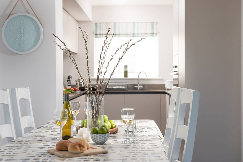 Dining table in open plan living space - Wish You Were Here
