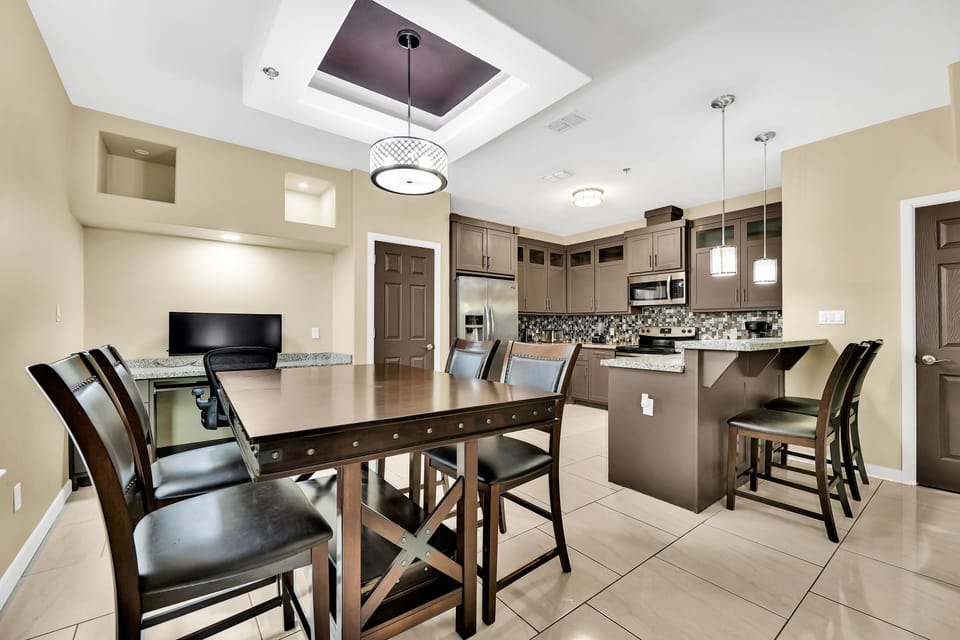 Dining for up to 6 with leaf. Table is counter height.