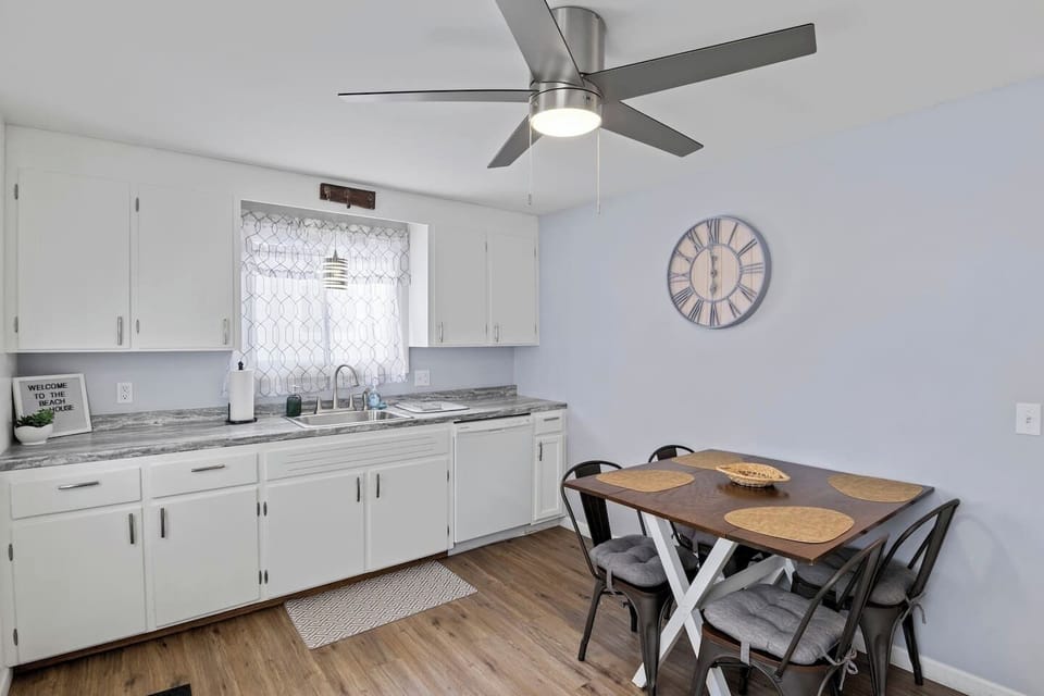 Fully stocked kitchen with all the cooking essentials, complemented by a beautiful dining table for the perfect meal experience
