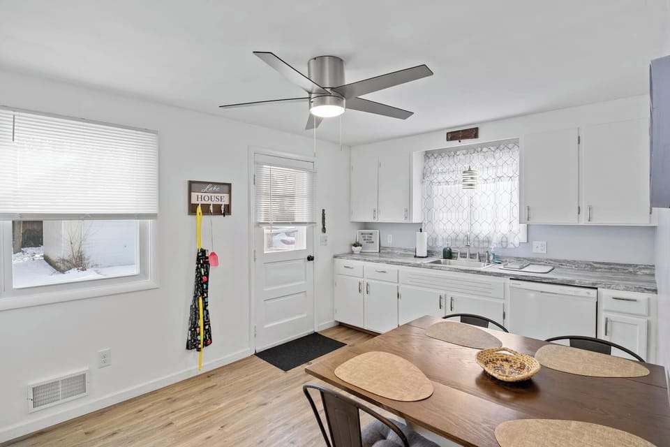 Fully stocked kitchen with all the cooking essentials, complemented by a beautiful dining table for the perfect meal experience